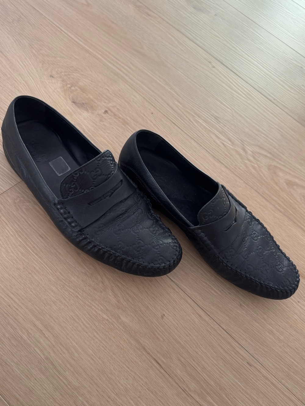 Gucci Black GG Embossed Leather Penny Loafers
